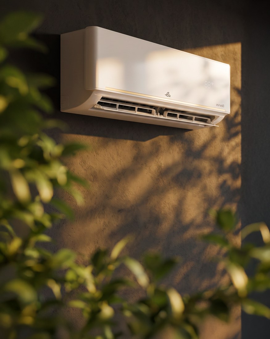 Il climatizzatore evvoli su una parete al sole, foglie in primo piano
